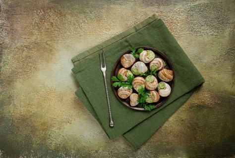 Grape snails stuffed in Burgundy, with butter and herbs, French cuisine, no people