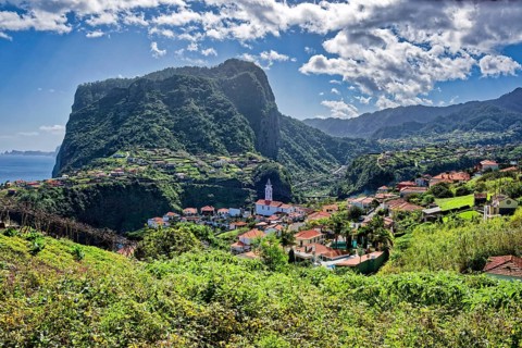 The village of Faial with a view of the landmark Eagle Rock from the Miradouro do Fortim viewpoint,