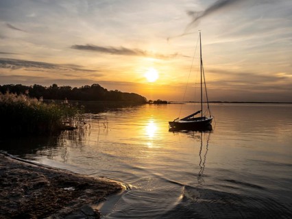 Sunset at lake Müritz, beach of village Rechlin, Müritz National Park, Germany, Europe