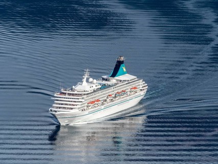 Cruise ship Artania leaving the Geirangerfjord into fjord Synnylvsfjord, seen from viewpoint at