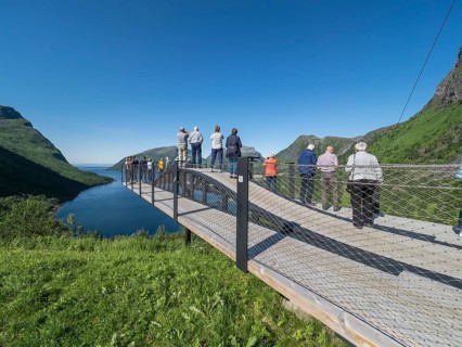 Tourist group visits viewing platform at Bergsbotn, viewpoint over fjord Bergsfjorden, Senja