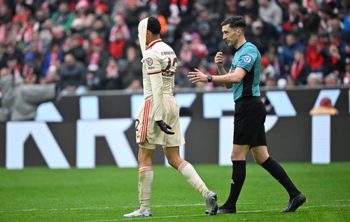 Jamal Musiala FC Bayern Munich FCB (42) disappointed pulls jersey over head Referee Florian
