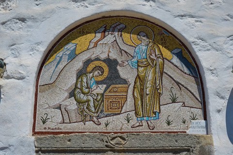 A mosaic wall painting on a church shows two holy figures in a religious scene, St John the