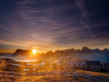 Schlernhaus at sunrise, Sassolungo Group and Catinaccio behind, Dolomites, Sciliar, South Tyrol,
