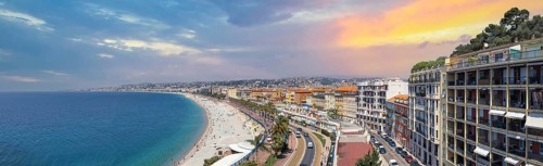 France, panoramic skyline of old historic Nice center and azure beaches along Promenade des