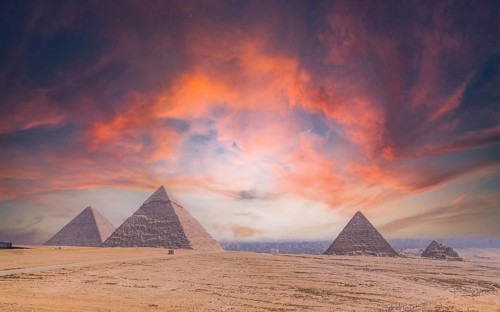 Pyramids of Giza at sunset, the oldest Funerary monument in the world. In the city of Cairo, Egypt,