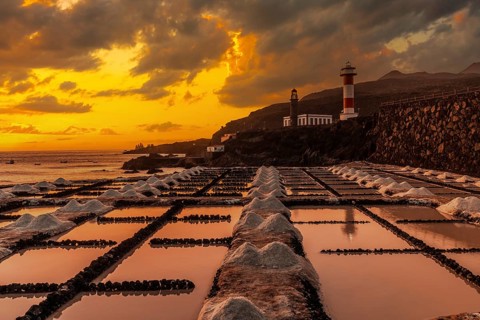 Sunset at the Fuencaliente Lighthouse next to the salt flats, on the route of the volcanoes south