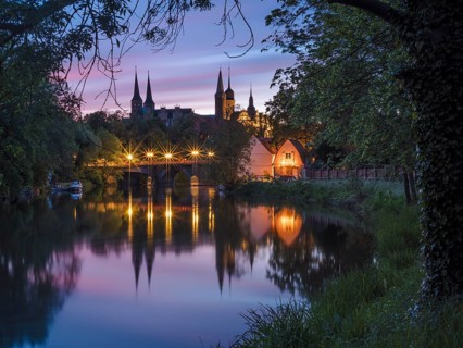 Merseburg Cathedral and Merseburg Castle reflected in the River Saale at dawn, Merseburg,