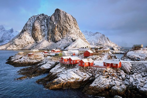 Famous tourist attraction Hamnoy fishing village on Lofoten Islands, Norway with red rorbu houses