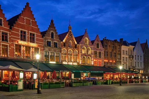 Bruges, Belgium, May 29, 2018: Bruges Grote markt square famous tourist place with many cafe and