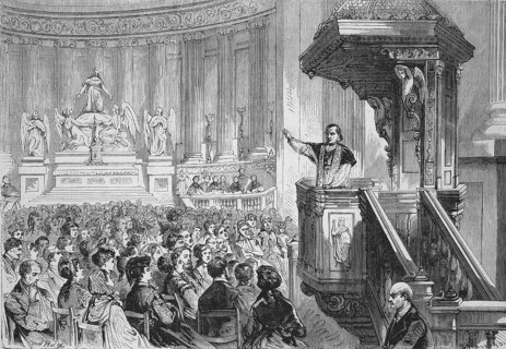 Monsignor farmer preaching from the pulpit in the Church of St. Mary Magdalene, La Madeleine,