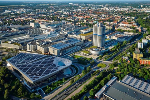 MUNICH, GERMANY, JULY 08, 2018: Aerial view of BMW Museum and BWM Welt and factory and Munich from