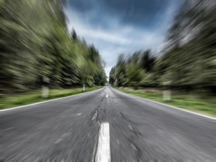 Photo with speed effect high speed speeding without speed limit from country road with central