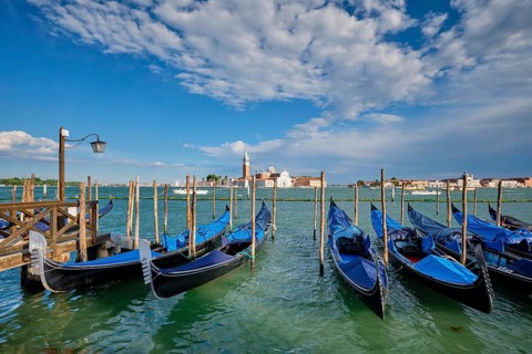 Gondolas and in lagoon of Venice by Saint Mark (San Marco) square with San Giorgio di Maggiore