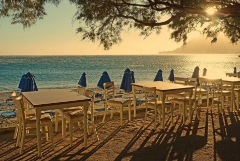 Gastronomy, tables and chairs on the beach, Plakias, Crete, Greece, Europe