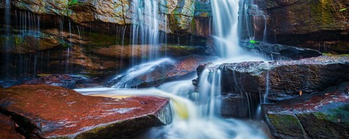 Panorama of tropical waterfall in jungle panorama with motion blur