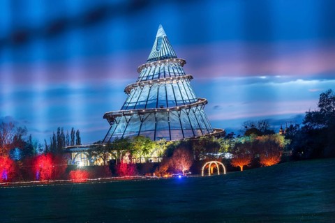 Red band of clouds passes the illuminated millennium tower in the Elbauenpark, landmark, Magdeburg,