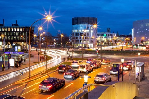 Evening city centre traffic in Essen, large intersection, roundabout, Berliner Platz, this area
