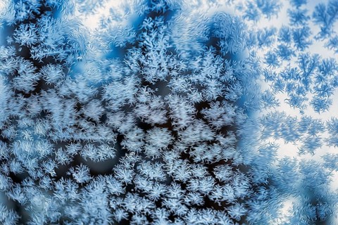 Ice crystals, snow crystals on glass, window pane of a flat in winter, illustration, symbol image,