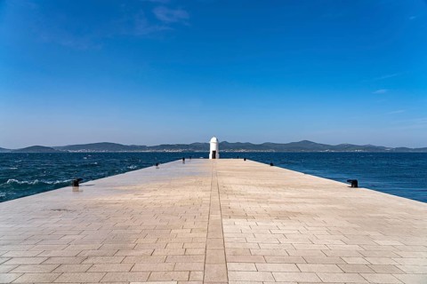 Small white lighthouse on the pier in Zadar, Croatia, Europe