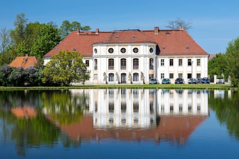 Baroque castle with reflection in the large pond, Königswartha, Upper Lusatia, Saxony, Germany,