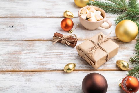 Christmas or New Year composition. Decorations, box, golden balls, cinnamon, fir and spruce