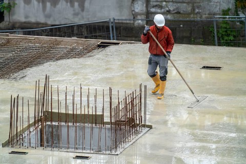 Construction site, concreting, the floor slab of a building is concreted, the fresh concrete is