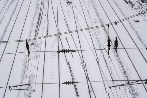 Onset of winter with lots of fresh snow and temperatures below -5 degrees during the day, railway