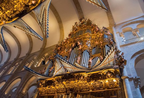Baroque organ with lavish golden decorations in a sacred interior, cathedral, Santiago de