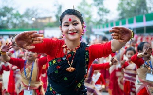 Participants with an instructor dance on the final day of a Bihu dance workshop ahead of Rongali