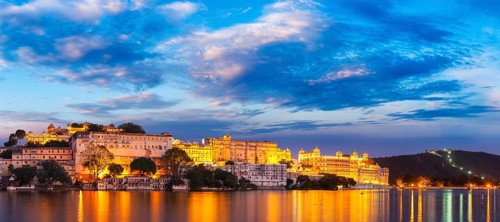 Panorama of famous romantic luxury Rajasthan indian tourist landmark, Udaipur City Palace in the