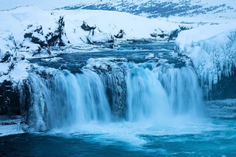 Godafoss waterfall, icy and snowy rock face, snowy landscape, Northern Iceland Eyestra, Iceland,