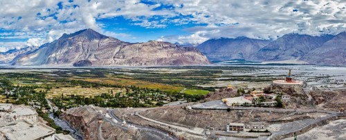Panorama of Nubra valley in Himalayas with giant Buddha statue in Diskit, Ladakh, India, Asia