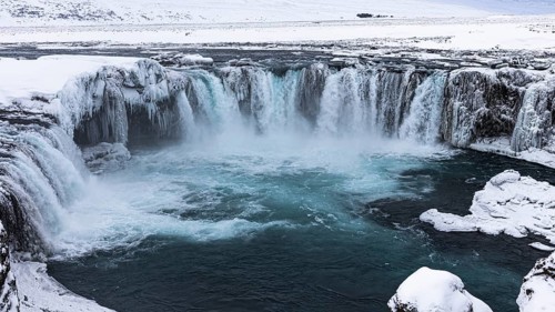 Godafoss waterfall, icy and snowy rock face, snowy landscape, Northern Iceland Eyestra, Iceland,