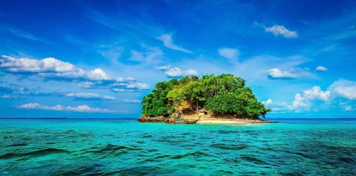 Panorama of tropical island and long-tail boat in sea. Thailand
