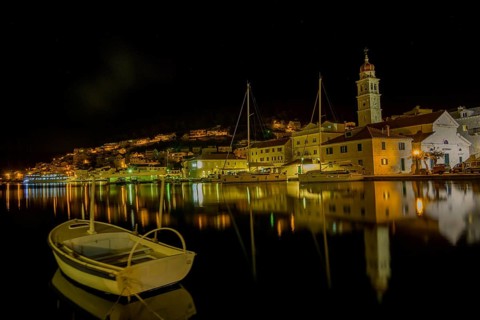 Church of St. Jerome of Stridon with rowing boat and sailboats at night, Pucišca, Split-Dalmatia