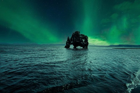 Hvitserkur landscape at night with beautiful Northern Lights. Iceland