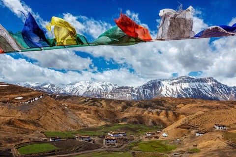 Buddhist prayer flags lungta with Om mani padme hum. . mantra written on them in sky over Comic
