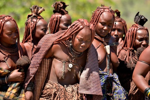 Mourning Himba women at a funeral, the widow in the middle, Omohanja, Kaokoland, Kunene, Namibia,