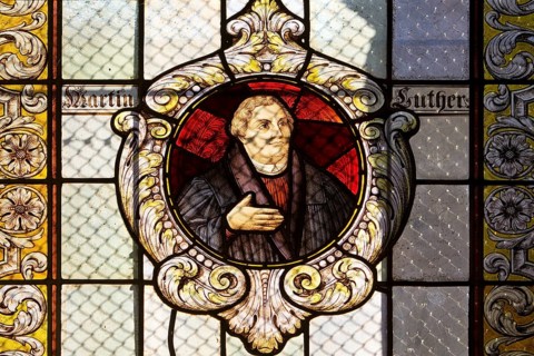 Stained glass window with Martin Luther in the Evangelical Lutheran Market Church of St Cosmas and