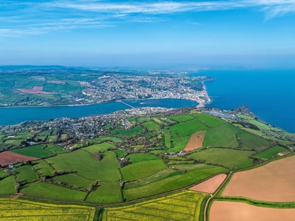 Rapeseed fields over the River Teign from a drone, Teignmouth, Shaldon, Devon, England, United