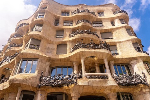 Wrought iron balconies and undulating facade of casa mila, a famous modernist building in