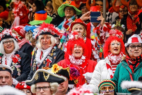 Colourfully costumed carnivalists celebrate carnival in Cologne, on Weiberfastnacht the street