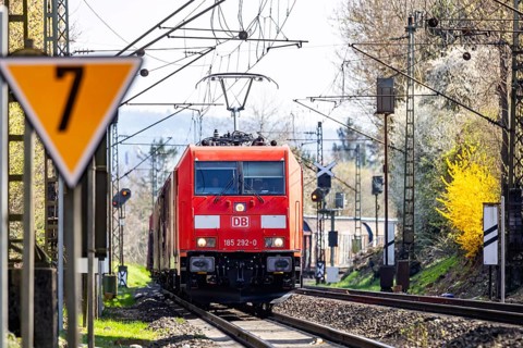 Goods train with a Deutsche Bahn AG locomotive travelling on the open track. Stuttgart,