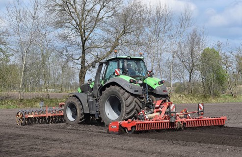 Tractor with harrows, disc harrows during tillage