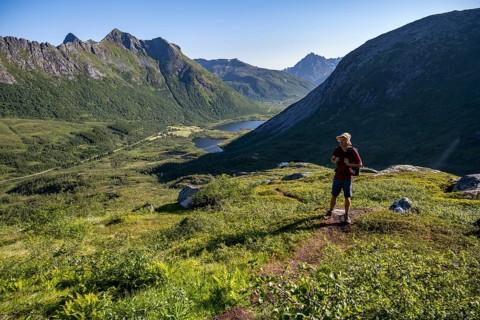 Mountaineers on a hiking trail to the summit of Rundfjellet, mountain landscape and valley with