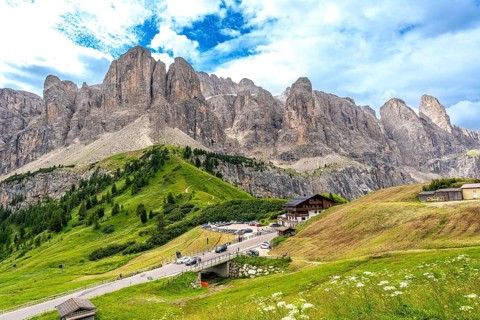 Breathtaking landscape showing the winding road of passo gardena and the majestic mountain range of