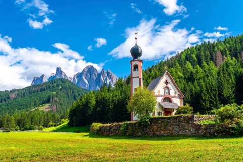 Scenic summer landscape with st. Magdalena church in the idyllic valley of val di funes, surrounded