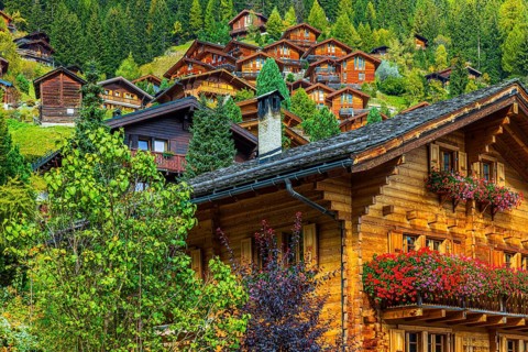 Wooden chalet decorated with flowers, Grimentz, Val d'Anniviers, Valais Alps, Canton Valais,
