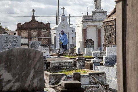 New Orleans, Louisiana - A groundskeeper at work in St. Joseph Cemetery #1, established in 1854.